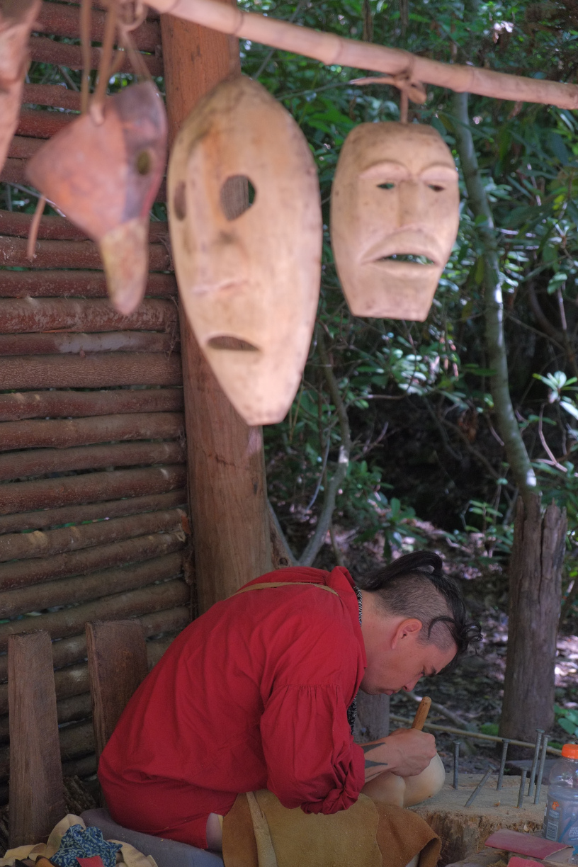 Cherokee crafstman making masks